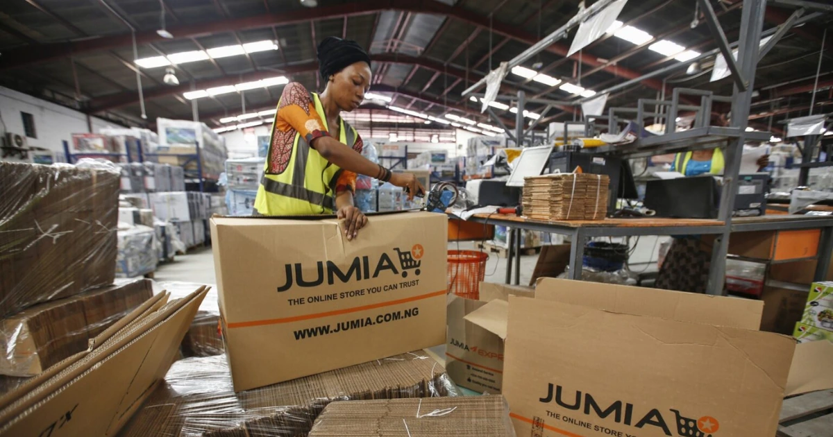 Jumia exit Tanzania Woman working with boxes in a Jumia warehouse